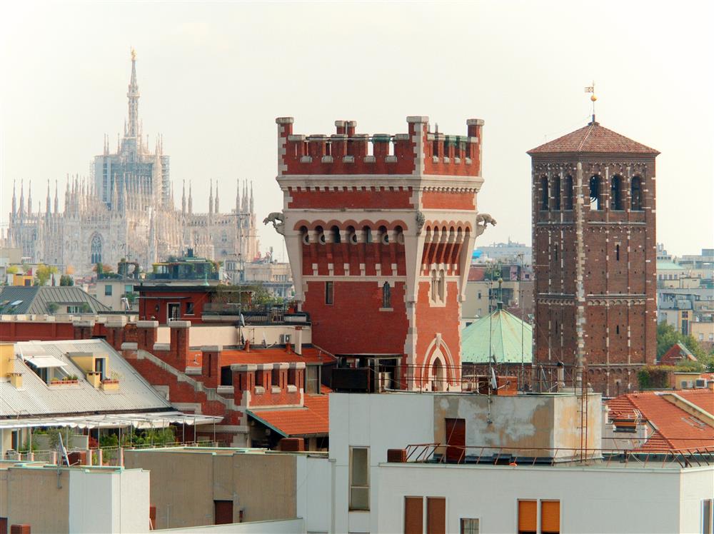 Milan (Italy) - Duomo, tower of the Cova Castle and main bell tower of the Basilica of Sant'Ambrogio